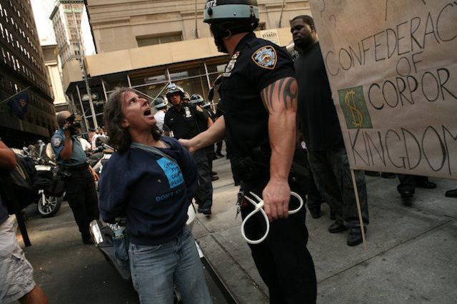 A protester is arrested on September 16, 2012